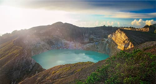 Watch sunrise over a volcano’s crater lakes.